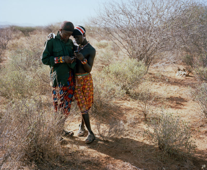 moran, listening to music, west gate community conservancy, northern kenya - with butterflies and warriors III - David Chancellor
